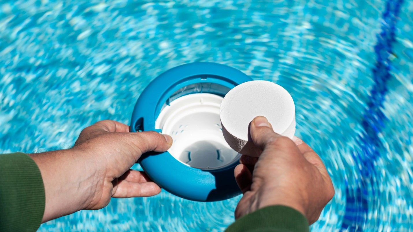 A puck of chlorine is placed inside a dispenser device.